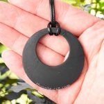 open circle pendant on the hand