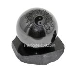 Shungite ball from Karelia with engraved Feng Shui