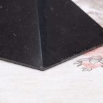 shungite pyramid edge chip detail close-up