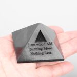 black stone pyramid in hand size reference