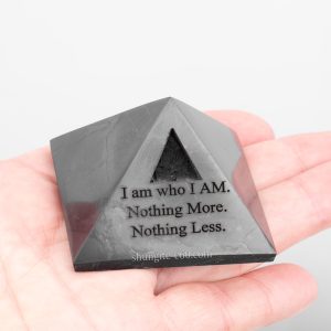 black stone pyramid in hand size reference