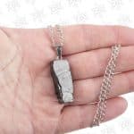 elite shungite pendant in hand size reference